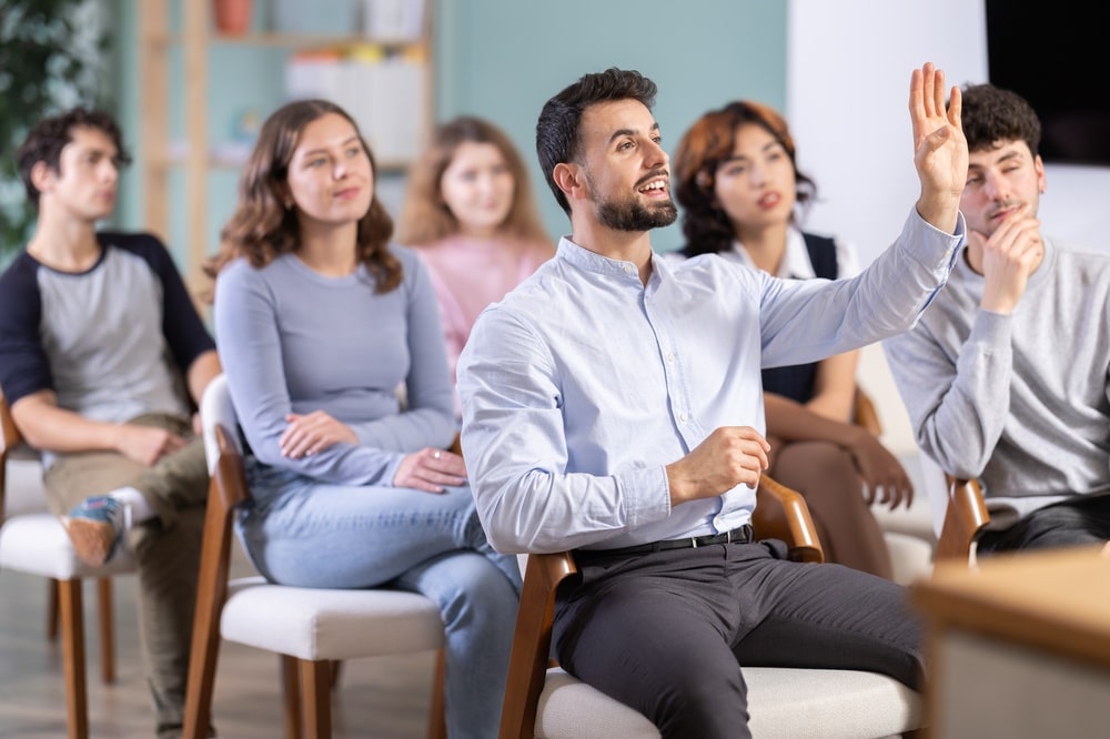 Positive,Young,Guy,Commenting,Something,During,A,Classroom,Training,Session